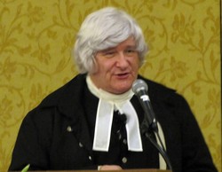 Photo of a man wearing a white wig