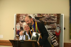 C. Lynn Cox hands an award to the Rev David E. Young