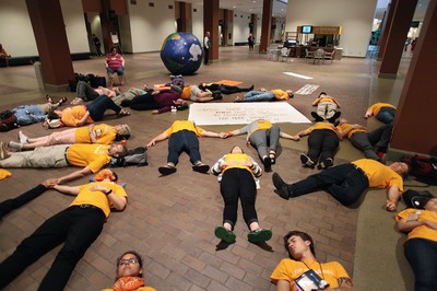 Fossil Free PCUSA representatives participate in a "die-in" in response to the divestment "no" vote.