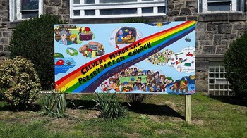 “Art Mural/outdoor sign created by neighborhood kids at Calvert Memorial Presbyterian Church’s after-school program — with images of life in the church and the children who helped create it.”