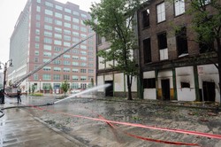 Louisville firefighters continue to contain fire and douse hot spots July 7, the day after a fire damaged historic buildings near the PC(USA) headquarters.