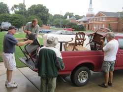 Furniture ministry volunteers from First Presbyterian Church of Burlington unload furniture at a client's home.