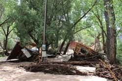 Flash flooding at Ghost Ranch destroyed the workshop areas of Pot Hollow, Short House and the Pole Barn, where ceramics and welding course were held.