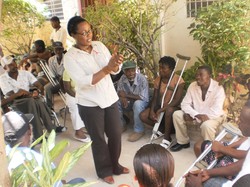 A social worker meets with those facing the challenges of disabilities in Haiti as part of Service Chretien d'Haiti's efforts to provide psychosocial support