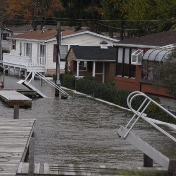 Docks rise in the water on a road in Stony Point on Oct. 29, 2012