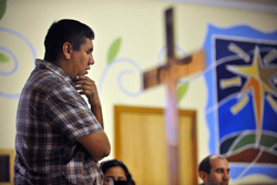 The Rev. Adan Mairena with his hand on his chin, in thought.