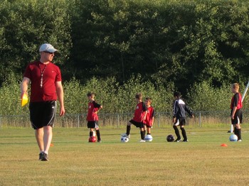 NCD pastor coaches youth soccer team as part of outreach ministry to young, unchurched familes
