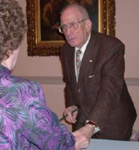 Chet Burger with a fan at a book signing.