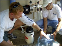 Participants learn about the installation of simple water systems at the May 2009 training session of Clean Water U.