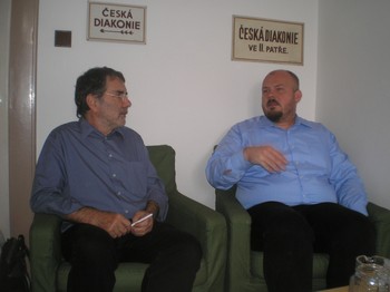 Burkhard Paetzold (left), the PC(USA)’s regional liaison for central Europe, discusses the diaconal work of the Evangelical Church of Czech Brethren with David Sourek of the ECCB.
