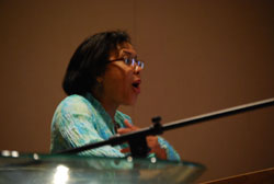 The Rev. Dr. Rhashell Hunter speaking from a lectern.