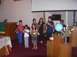Children singing during a church service.