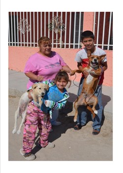 Women with their children and dogs in Ciudad Juarez, Mexico