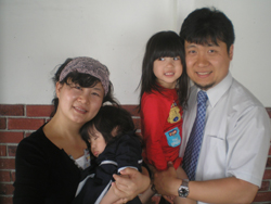 Heea Lee and Joey Chang, with Joey holding his young daughter, Lydia.