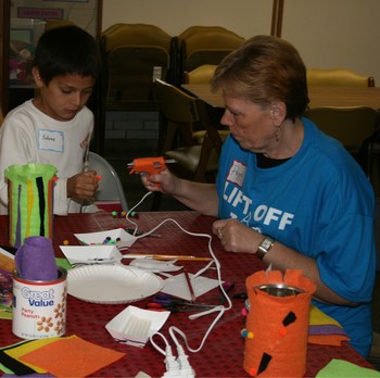 Children working on crafts at after school program for unchured kids
