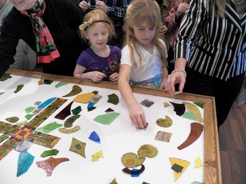 Members collected shards of broken glass from the broken stained glass windows and formed a mosaic tabletop that will be used as the congregation’s new communion table.
