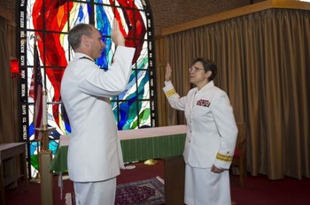 U.S. Navy Adm. Jonathan Greenert gives Rear Adm. Margaret Kibben the oath of office and promotes her to the rank of rear admiral and to Chief of Chaplains, succeeding Rear Adm. Mark Tidd who is retiring from naval service.