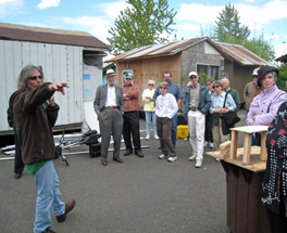 Dignity Village resident Joe Palinkas gives members of Emmanuel Presbyterian Church a tour of the village.