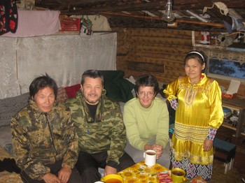 Pastor Vladimir Tashtiev (second from left) and Ellen Smith (second from right) with Pasha (left) and Tamara (right), a Khanti couple near Nizhnevartovsk in Siberia, where one of the PC(USA)’s newest “twinning” congregations is located.