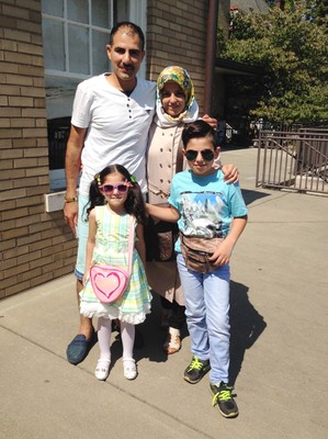 Newly arrived Syrian refugees, Shadi and Hanadi Antakli with daughter Tuqa and son Hasan, at their Louisville home.