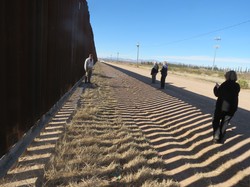 The wall keeping migrants from crossing along border towns.