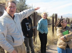 Learning from mission co-worker Mark Adams, where the fence ends, open mountains desert begin.