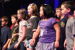 Children sing during worship at Big Tent 2013 in Louisville.