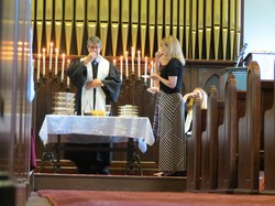 Pastor Joel Weible celebrates communion in the newly renovated Pewee Valley Presbyterian Church.
