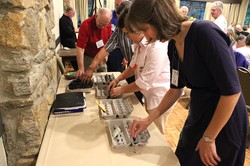Attendees at the Presbyterians for Earth Care 2015 Conference plant seeds during the 20th anniversary commemoration service.