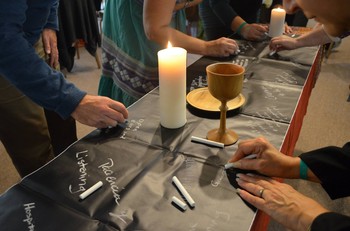 Prayers and hopes are written during communion at the conference on race, ethnicity, racism and ethnocentricity held at Stony Point Conference Center in New York.