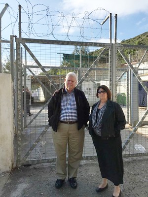 PC(USA) Moderator Heath Rada and Presbyterian Disaster Assistance Coordinator the Rev. Dr. Laurie Kraus stand outside of a detention camp on Samos Island, Greece. Several hundred refugees are interned there.