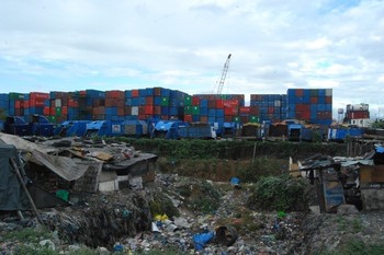 Stacks of shipping containers in the Philippines that companies park near landfill sites.