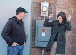 Rachel Davis celebrates flipping the switch to solar power in January, 2012.