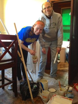 Emma and Eric Eisenbraun working on their Lentecost pledge at the Home Repair and Rebuilding Program.