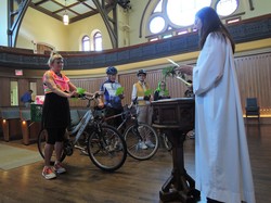 Officiant Ann Russell presides over the sixth annual Blessing of the Bikes at Toronto’s Trinity-St. Paul’s United Church on June 7, 2015.