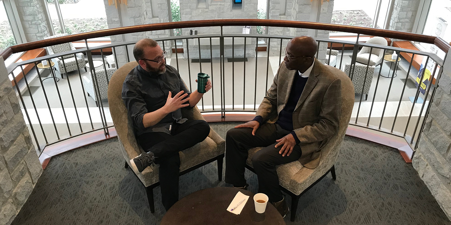 The Rev. Dr. J. Herbert Nelson, II, Stated Clerk of the General Assembly, at right, interviews Presbyterian Disaster Assistance filmmaker David Barnhart during “Coffee with the Clerk.” (Photo by Randy Hobson)