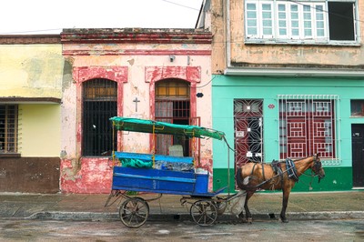 A horse cart from a distribution center next door sits in front of the Presbyterian Mission in Camagüey.
