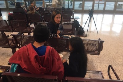 Amanda Craft, manager of Immigration Advocacy with the PC(USA) Office of the General Assesmbly, meets with a father and daughter at the McAllen, Texas bus station. 