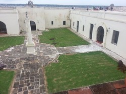 The interior courtyard and former prison cells at San Severino Castle, one of the first ports of entry of the transatlantic slave trade. It’s now home to the UNESCO Slave Route Museum. Photo by Molly Casteel