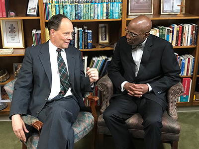 Rev. Dr. Matthew Covington (left) discusses Presbyterian Church of Bowling Green's milestone anniversary with Stated Clerk J. Herbert Nelson, II (right) during Coffee with the Clerk.