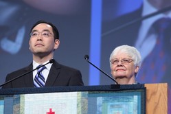 Stepnen Choi (left) and Ginny Sheets (right), moderator and vice moderator of Committee 14, Middle East Issues, addressed plenary VII at the 221st General Assembly (2014) of the PC(USA) in Detroit, MI on Thursday, June 19, 2014. 