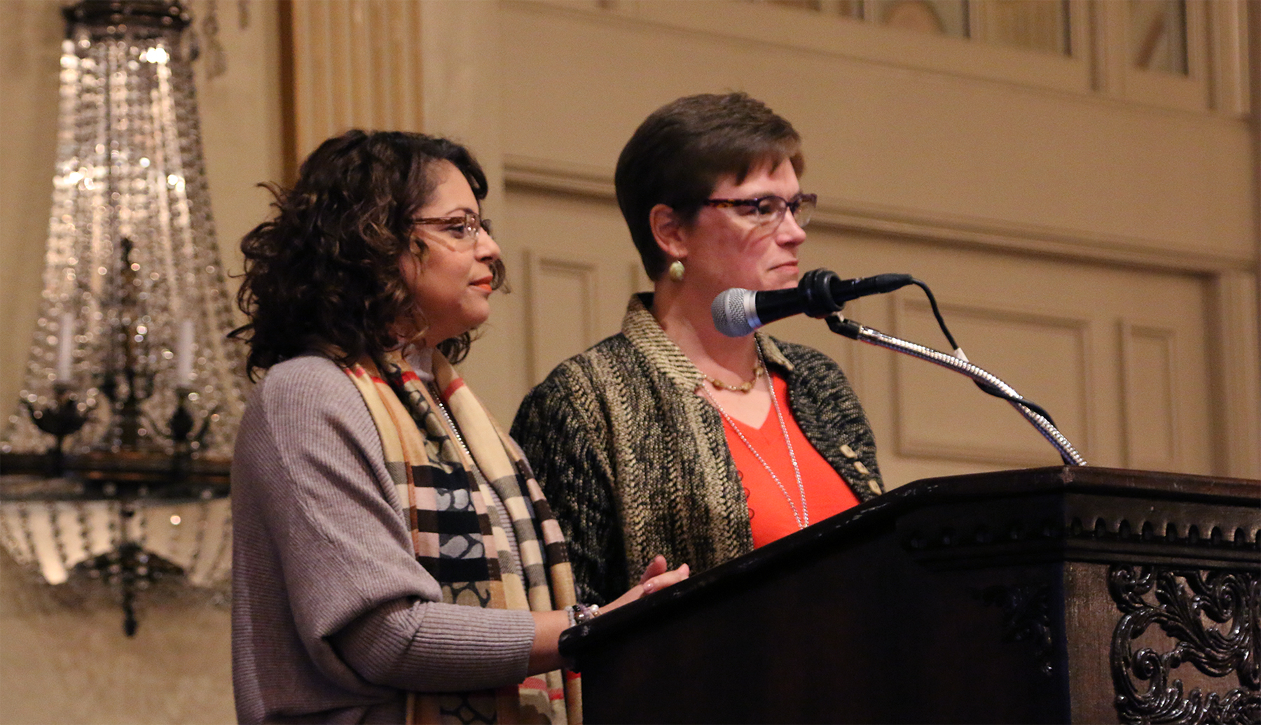 Elder Vilmarie Cintron-Olivieri and the Rev. Cindy Kohlmann, Co-Moderators of the 223rd General Assembly announce their decision to change books for their book study program at the Moderators’ Conference in Louisville, Kentucky. Photo by Rick Jones.