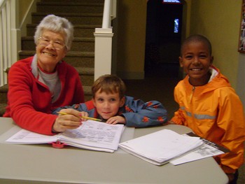 Irene Orando with two kids at the Trinity Afterschool Program in 2012.