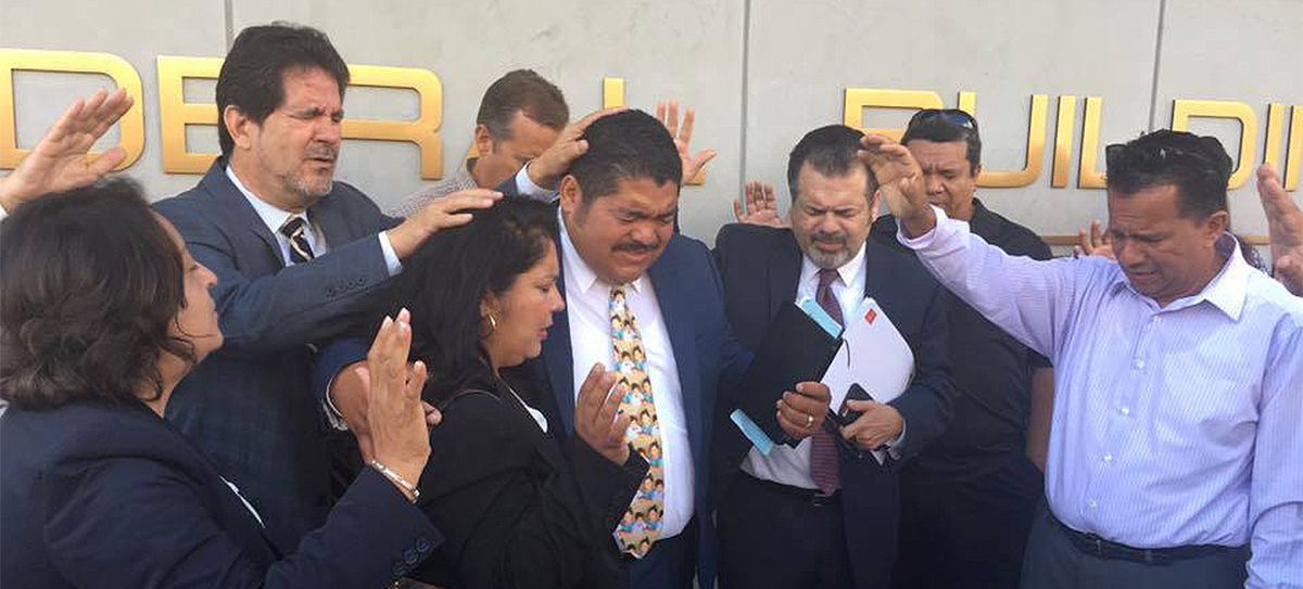 Praying Pastor Noe into his check-in with ICE before he was taken away in handcuffs