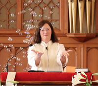 Photo of Sue Washburn preaching