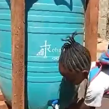 Children using an outdoor handwashing apparatus
