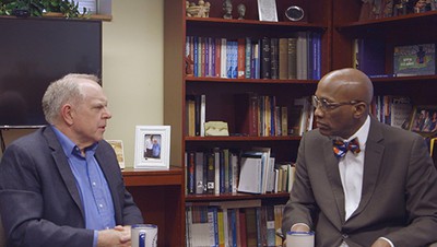 Stated Clerk J. Herbert Nelson, II (right) discusses chaplaincy with Rev. Lyman Smith (left).