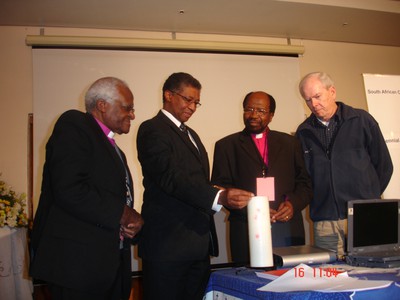 Archbishop Tutu, the late Prof. Russel Botman (then president of the South African Council of Churches), and two other former SACC presidents (Bishop Manas Buthelezi and Bishop Peter Storey) at a celebration of the 40th anniversary of the SACC in July 2007. Photo by Doug Tilton