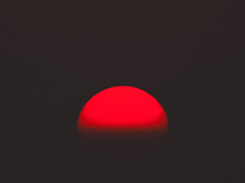 image of red half circle with black background