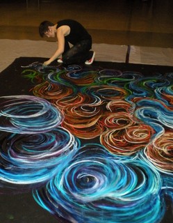 Photo of a woman working on a piece of art